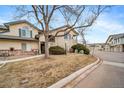 Well-maintained townhome with a front lawn and assigned parking at 8621 E Dry Creek Rd # 325, Englewood, CO 80112