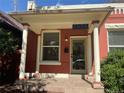 Inviting porch featuring brick accents, white columns, and clear address display at 3616 N Gilpin St, Denver, CO 80205