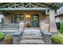 Inviting front entrance with stone steps and a brick facade at 549 N Ogden St, Denver, CO 80218
