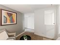 Inviting sitting area featuring a chair, small table, and view into the next room at 1120 N Clarkson St # 6, Denver, CO 80218