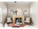 Inviting living room showcases a fireplace with mantle and cozy seating arrangement for relaxation at 9804 Martin Luther King Blvd, Denver, CO 80238