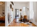 Cozy dining area with hardwood floors, stylish furnishings, and an inviting atmosphere for Gathering meals at 2841 W 27Th Ave, Denver, CO 80211