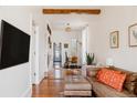 Bright living room with hardwood floors, modern décor, and a comfortable seating area with natural light at 2841 W 27Th Ave, Denver, CO 80211
