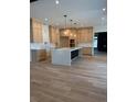Gourmet kitchen with white countertops, hardwood floors, and custom cabinets at 2442 S Saint Paul St, Denver, CO 80210