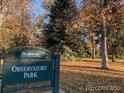 Scenic view of Observatory Park with trees, grass, and walking paths on a sunny day at 2442 S Saint Paul St, Denver, CO 80210