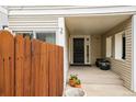 Inviting front porch with a decorative door, potted plants, and a cozy entrance at 1050 S Monaco Pkwy # 35, Denver, CO 80224
