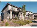Beautiful two-story home with a covered porch and manicured landscaping in a suburban neighborhood at 2967 S Quaker St, Morrison, CO 80465