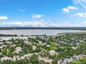 An aerial shot capturing the neighborhood nestled near a beautiful, expansive lake and scenic landscape at 6700 W Dorado Dr # 47, Littleton, CO 80123