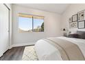 Bright bedroom with large window, neutral decor, and closet, offering a cozy and relaxing space at 1820 Newland Ct # 210, Lakewood, CO 80214