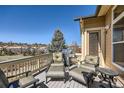 Enjoy outdoor living on this deck with ample seating and a gas grill, offering neighborhood views at 7009 Winter Ridge Pl, Castle Pines, CO 80108