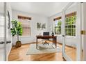 Cozy home office with hardwood floors, natural light, and stylish decor accents at 8073 S Albion St, Centennial, CO 80122