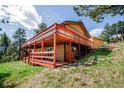 Expansive backyard deck, perfect for outdoor entertaining or enjoying the natural surroundings at 8624 S Doubleheader Ranch Rd, Morrison, CO 80465