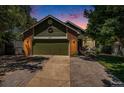 Charming single-Gathering home with a brick facade and a well-manicured lawn during dusk at 10957 Bryant St, Westminster, CO 80234