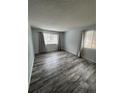 Living room featuring gray wood-look flooring and neutral walls at 12652 E Warren Dr # C, Aurora, CO 80014