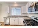 Kitchen offers granite countertops, stainless steel appliances, and a window above the sink for natural light at 23950 E 41St Ave, Aurora, CO 80019