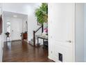 Elegant home foyer with hardwood floors, staircase, and a well-lit interior at 3385 Birch Rd, Longmont, CO 80504