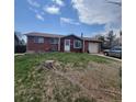 Charming home with a well-maintained lawn, and a convenient attached garage at 9008 Dover St, Broomfield, CO 80021