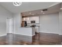 Open kitchen with white cabinets and granite countertops, great for entertaining guests at 14251 E 1St Dr # 308, Aurora, CO 80011