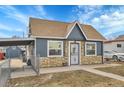 Quaint single-story home featuring stone accents, siding, and a convenient carport for covered parking at 3368 W Gill Pl, Denver, CO 80219