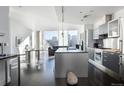 Bright, modern kitchen with stainless steel appliances at 55 W 12Th Ave # 211, Denver, CO 80204