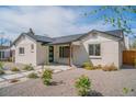 Attractive home with a well-maintained yard and walkway that leads to the front door at 6935 W 16Th Ave, Lakewood, CO 80214