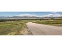 Scenic view of a winding country road with rolling hills in the background at 8963 Whiteclover St, Littleton, CO 80125