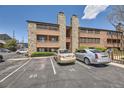 Exterior of building featuring wood and stone with ample parking available for tenants at 4691 S Decatur St # 215, Englewood, CO 80110