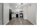 Bright kitchen features white cabinets, modern appliances, and hard surface countertops at 8843 Colorado Blvd # 208, Thornton, CO 80229