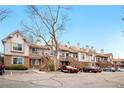Townhome complex featuring well-maintained exteriors and convenient parking at 185 S Sable Blvd # T18, Aurora, CO 80012