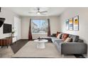 Comfortable living room with a stylish sofa, rug, and modern decor at 185 S Sable Blvd # T18, Aurora, CO 80012