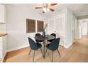Bright dining area with a modern table, chairs, and light fixture at 7946 Chase Cir # 112, Arvada, CO 80003