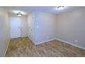 Neutral bedroom featuring a door and large closet for plenty of storage space at 799 Dahlia St # 201, Denver, CO 80220
