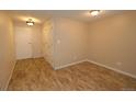 Neutral entryway featuring coat closet, ceiling light and tile flooring at 799 Dahlia St # 201, Denver, CO 80220