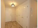 Neutral entryway featuring coat closet, ceiling light and tile flooring at 799 Dahlia St # 201, Denver, CO 80220