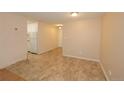 Open floor plan featuring neutral walls, tile flooring, kitchen and living room area at 799 Dahlia St # 201, Denver, CO 80220