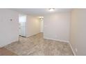 Living room features neutral walls and tile floors with an entrance to the kitchen at 799 Dahlia St # 201, Denver, CO 80220
