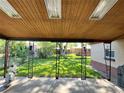 Covered patio with a view of the backyard, perfect for relaxing and entertaining guests at 2124 S Yates St, Denver, CO 80219