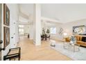 Bright and spacious living room with hardwood floors and large windows at 6716 W 97Th Cir, Broomfield, CO 80021