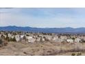 Picturesque view of a peaceful residential neighborhood with beautiful houses and scenic mountain views at 9957 Candlewood Ln, Highlands Ranch, CO 80126