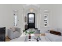 Bright and spacious entryway with high ceilings and a stylish chandelier at 1312 Jade Ln, Longmont, CO 80504
