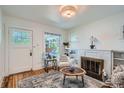Cozy living room featuring a fireplace and bright natural light at 764 S Sherman St, Denver, CO 80209