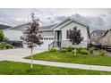 Charming two-story home with landscaped yard and attached two car garage at 22662 E Narrowleaf Cir, Aurora, CO 80016
