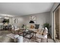 Spacious living room open to dining and kitchen area at 7476 E Arkansas Ave # 1-03, Denver, CO 80231