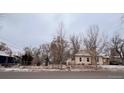 Street view of house showing the side and front yards at 3890 N Wolff St, Denver, CO 80212