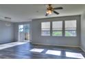 Inviting living room features lots of natural light, ceiling fan, and sleek flooring at 17205 Waterhouse Cir # C, Parker, CO 80134