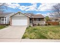 Charming single-Gathering home with stone accents, a well-manicured lawn, and a two-car garage, perfect for suburban living at 13906 Jackson St, Thornton, CO 80602