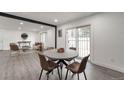Cozy dining area with modern table, stylish chairs, and easy access to the living room at 1326 Sable Blvd, Aurora, CO 80011