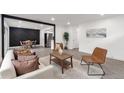 Open-concept layout with stylish living room, adjacent dining area, and modern finishes at 1326 Sable Blvd, Aurora, CO 80011