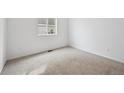 Bedroom with neutral carpet, a window for natural light, and convenient electrical outlets at 6615 N Nepal St, Aurora, CO 80019