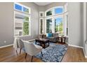 Sunlit living room with plush seating and large windows at 10531 Lieter Pl, Lone Tree, CO 80124